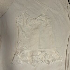 White mini dress. Not sure of size but it fits me and I’m usually a medium